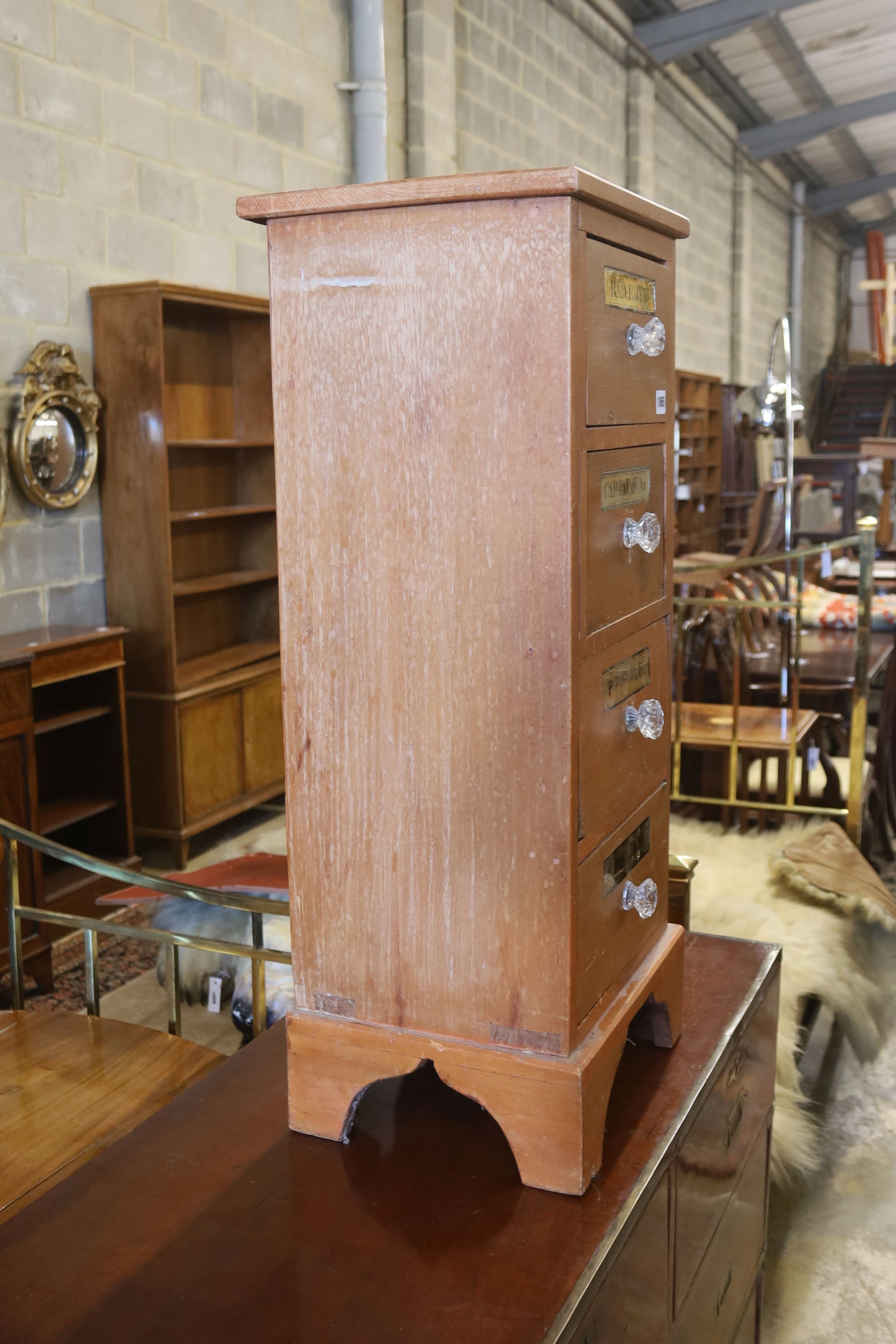 A Victorian style pine four drawer apothecary cabinet, width 35cm, depth 30cm, height 85cm